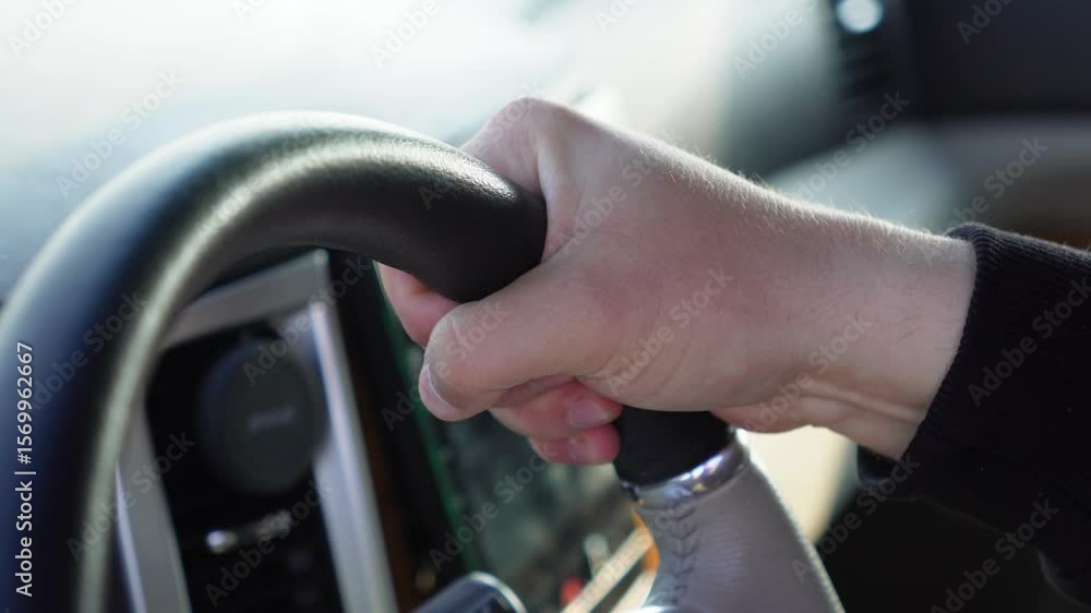 tensely grips the steering wheel with his fingers tensely grips the steering wheel with his fingers