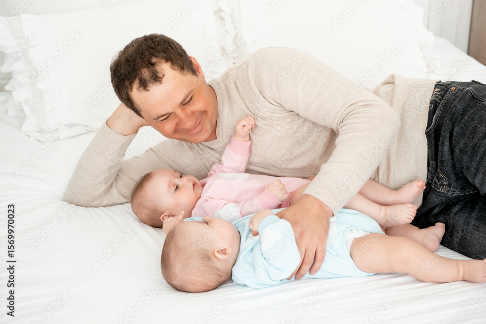 two babies, a boy and a girl in a wicker cot in the bedroom, a cute little baby of six months together, a place for text, newborn twins two babies, a boy and a girl in a wicker cot in the bedroom, a cute little baby of six months together, a place for text, newborn twins