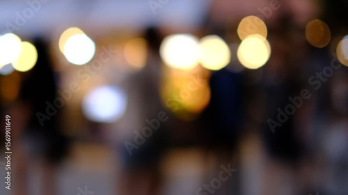 Wallpaper Mural A blurry photo of a group of people walking down a street. The people are wearing shorts and the photo is in black and white. Scene is somewhat mysterious and somewhat nostalgic Torontodigital.ca