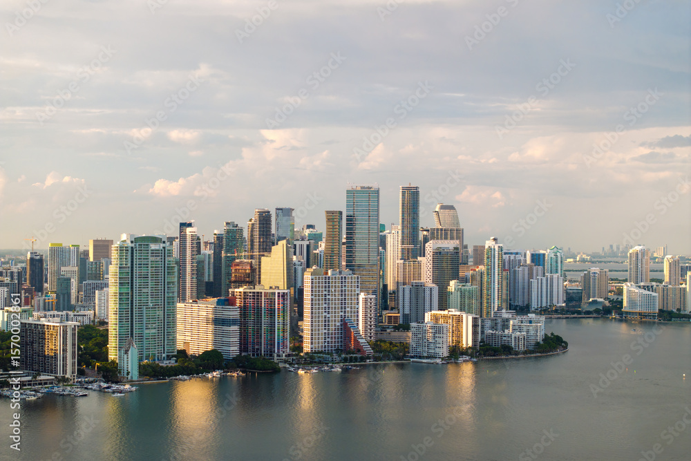 Fototapeta premium Urban cityscape of Miami Brickell downtown district in Florida, USA. Skyline with waterfront skyscraper buildings in modern American city