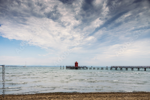 Pier and lighthouse on the sea, Lignano Sabbiadoro, Italy