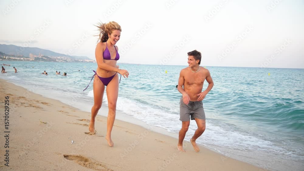 Happy couple running playfully along the sandy shoreline, enjoying a sunny summer day filled with excitement and laughter, creating beautiful memories together by the ocean waves and coastline. Happy couple running playfully along the sandy shoreline, enjoying a sunny summer day filled with excitement and laughter, creating beautiful memories together by the ocean waves and coastline.