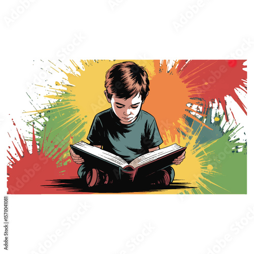 Young boy sitting cross legged engrossed in reading a book with colorful paint splatters