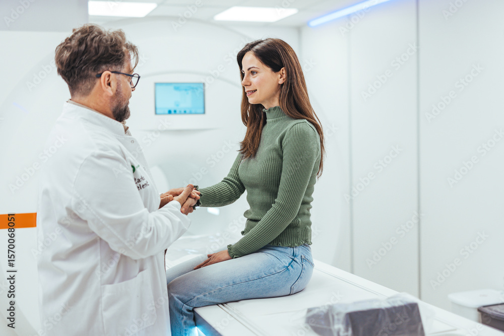 Fototapeta premium Doctor and Patient Shaking Hands in a Modern Healthcare Facility