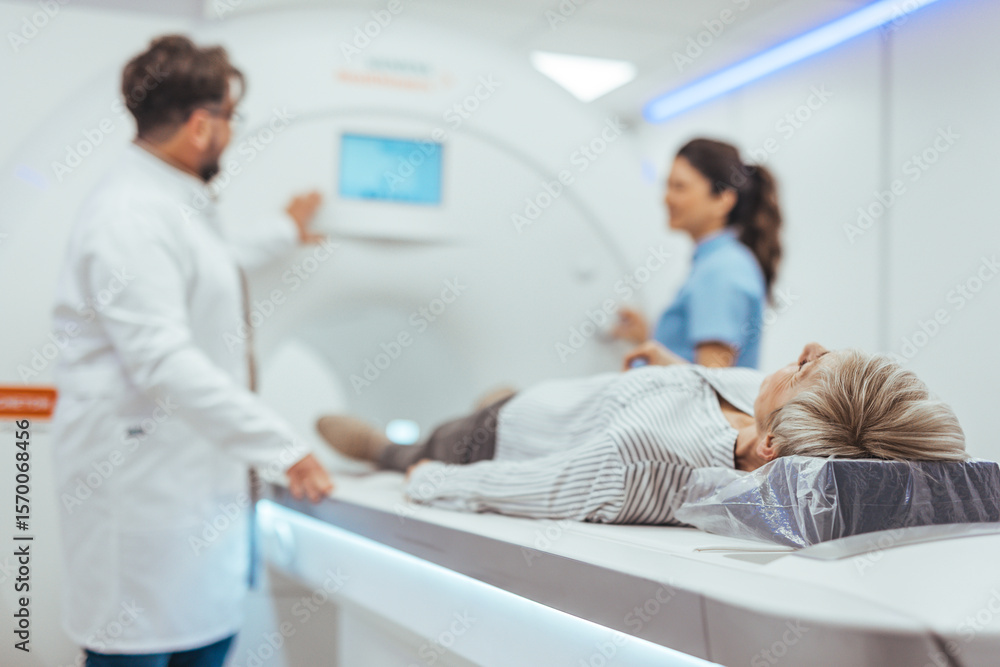 Doctor and Nurse Assisting a Patient During a Medical Imaging Procedure Doctor and Nurse Assisting a Patient During a Medical Imaging Procedure