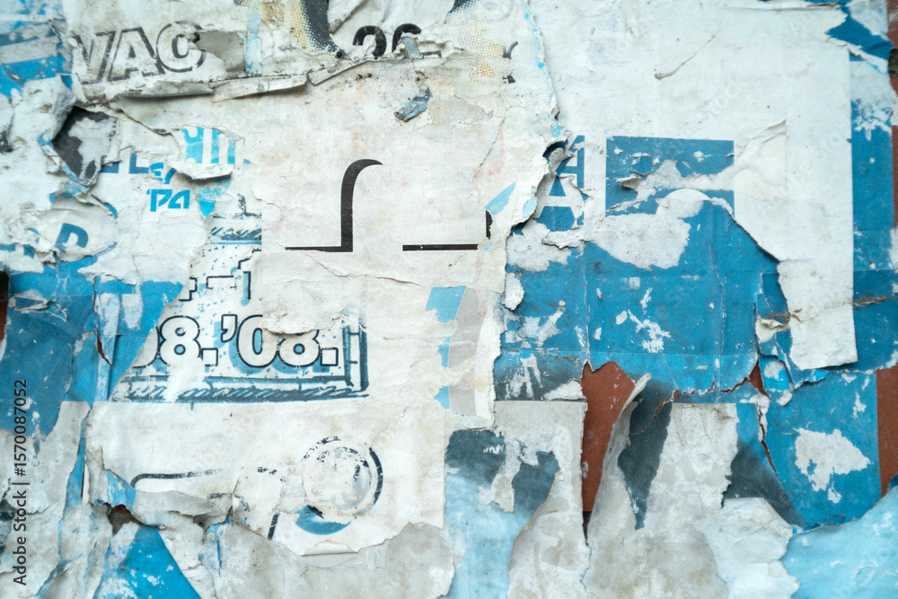 Fototapeta premium Art collage of a ripped and torn street poster background