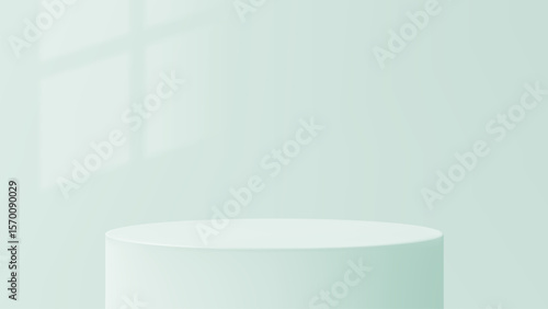 Light green cylinder podium with shadow for product presentation. Minimalist empty stage for cosmetic display or luxury item showcase.
