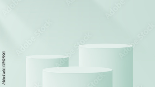 Three green cylindrical product podiums with blank space. Minimalist geometric display for cosmetic marketing and abstract studio.
