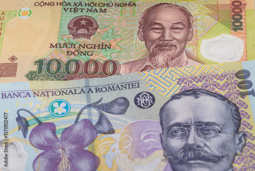 Wallpaper Mural 10000 Vietnamese dong and 100 Romanian leu banknotes. International trade concept Torontodigital.ca