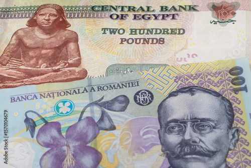 Wallpaper Mural 200 Egyptian pound and 100 Romanian leu banknotes. International trade concept Torontodigital.ca
