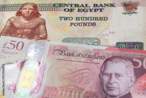 Wallpaper Mural 200 Egyptian pound and 50 British pound banknotes. International trade concept Torontodigital.ca