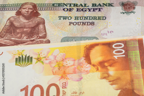 Wallpaper Mural 200 Egyptian pound and 100 Israeli shekel banknotes. International trade concept Torontodigital.ca