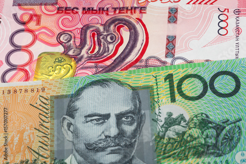 Wallpaper Mural 5000 Kazakhstani tenge and 100 Australian dollar banknotes. International trade concept Torontodigital.ca