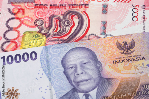 Wallpaper Mural 5000 Kazakhstani tenge and 10000 Indonesian rupiah banknotes. International trade concept Torontodigital.ca