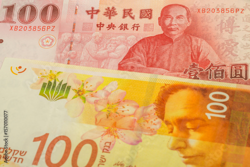 Wallpaper Mural 100 New Taiwan dollar and 100 Israeli shekel banknotes. International trade concept Torontodigital.ca
