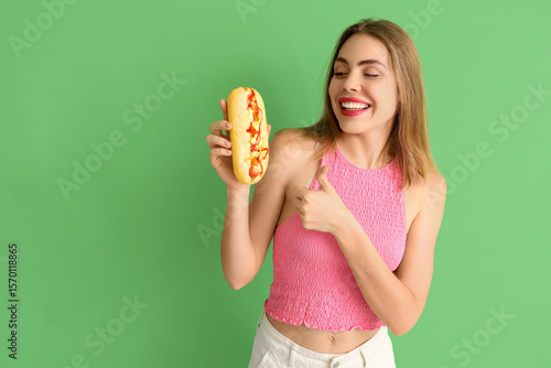 Pretty young woman with tas...