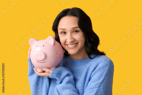Pretty young woman with pig...