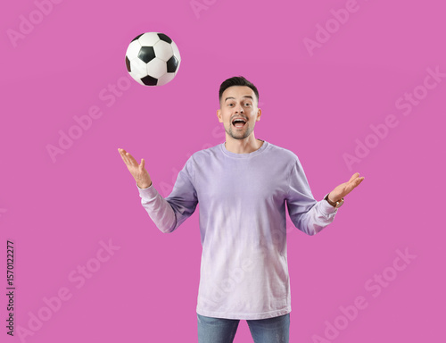 Happy young man with soccer...