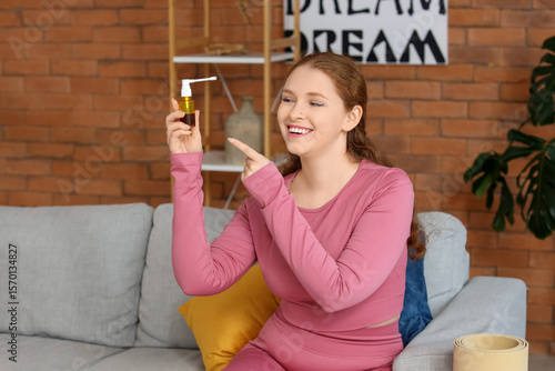 Happy young woman pointing ...