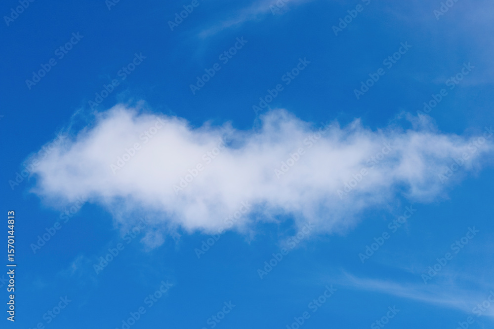 A solitary, bright white cumulus cloud floats in a clear blue sky, typical of the São Paulo region, with subtle hints of other clouds in the distance. A solitary, bright white cumulus cloud floats in a clear blue sky, typical of the São Paulo region, with subtle hints of other clouds in the distance.