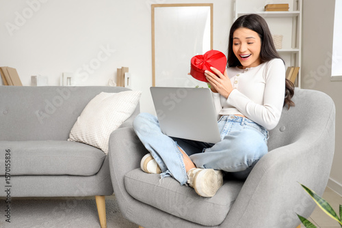Young woman video chatting ...