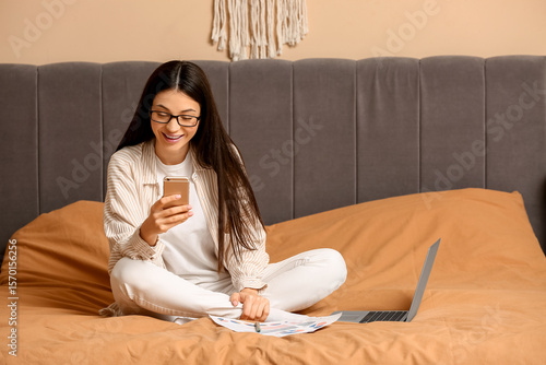 Smiling young woman in glas...