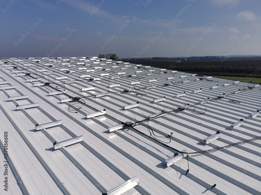 Fototapeta premium Structure on the house roof for solar panels with installed power optimizers
