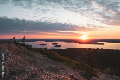 Sunrise from Cadillac Mountain in Acadia National Park, Maine, overlooking the Atlantic and surrounding islands. A breathtaking, tranquil moment from the highest peak on the U.S. East Coast.