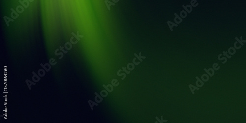 Soft green light rays shining down on a dark background