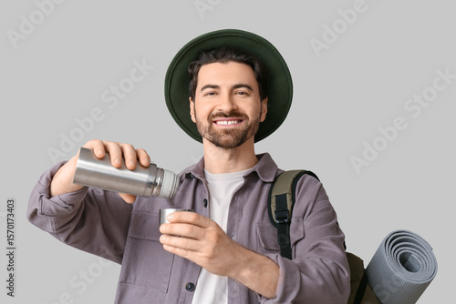 Young male tourist with bac...