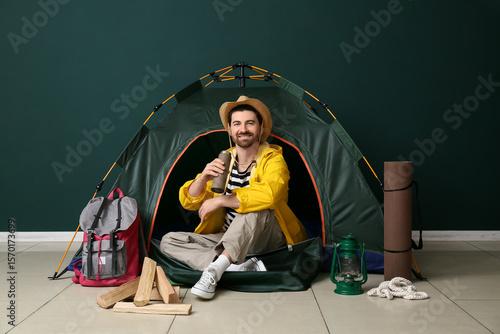 Young male tourist with ten...