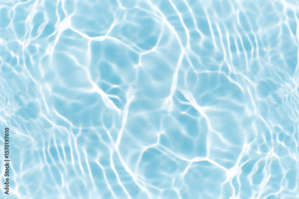 Obraz premium Blue water with ripples on the surface. Defocus blurred transparent blue colored clear calm water surface texture with splashes and bubbles. Water waves with shining pattern texture background.