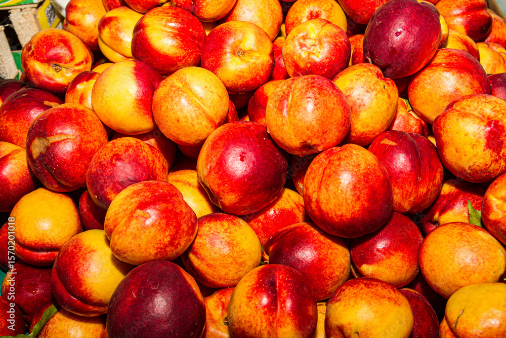 High energy antioxidant food, health booster juicy nectarines super fruit on sale at local fruit market. Nutrition healthcare concept High energy antioxidant food, health booster juicy nectarines super fruit on sale at local fruit market. Nutrition healthcare concept