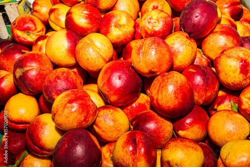 High energy antioxidant food, health booster juicy nectarines super fruit on sale at local fruit market. Nutrition healthcare concept