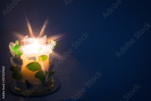 Hand crafted Green and Blue seaglass candle holder.  Star filter used for flame.