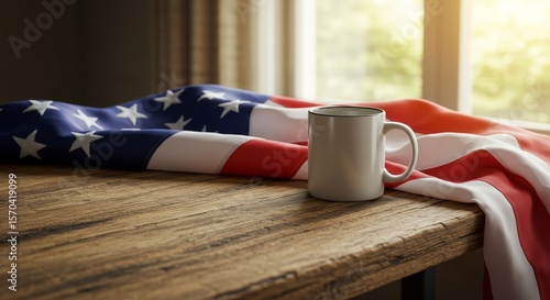 American Flag Draped Coffee Mug - A white mug rests on a rustic wooden table, partially covered by a folded American flag.