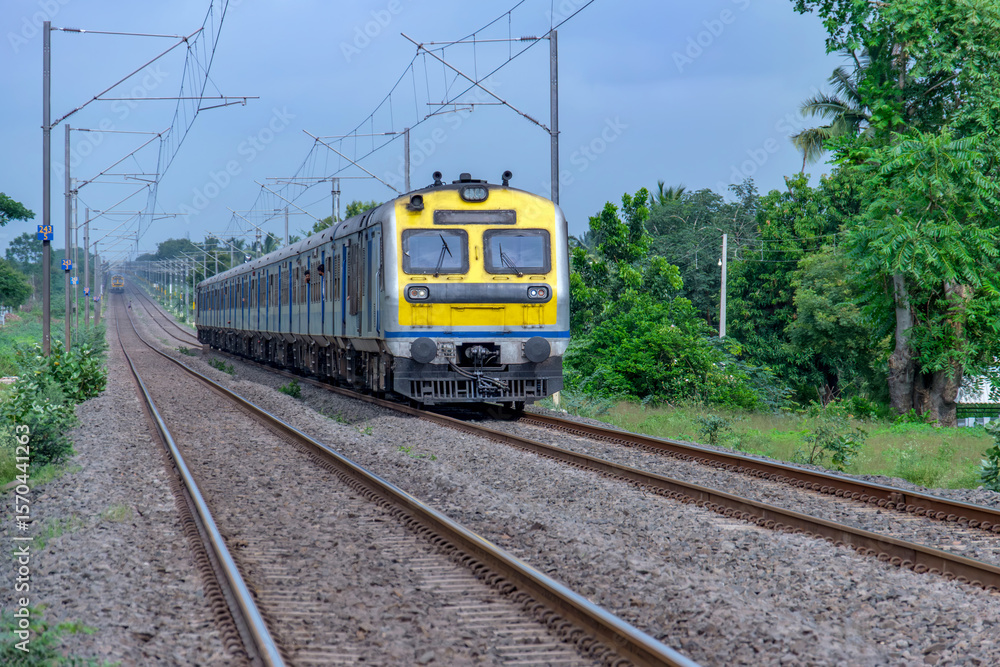 Naklejka premium A local suburban commuter train in the countryside near Pune India.