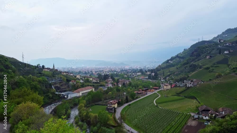 Ascending aerial drone shot flying over vineyards near Roncolo Castle, countryside Ascending aerial drone shot flying over vineyards near Roncolo Castle, countryside