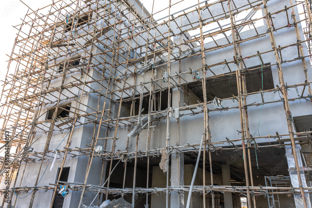 Bamboo scaffoldings at under construction building for high risk workers in site Bamboo scaffoldings at under construction building for high risk workers in site