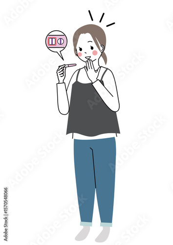 妊娠検査薬で妊娠が判明して喜んでいる女性