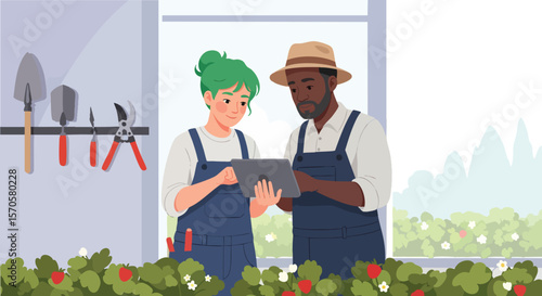Diverse Gardeners Utilizing Digital Tablet to Manage Healthy Strawberry Plants in Modern Greenhouse