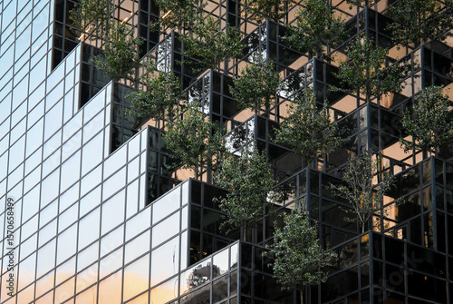 Modern Green Architecture with Trees Integrated into Facade Design
