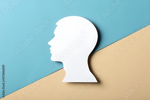 Minimalistic White Paper Silhouette of Human Head on Blue to Beige Gradient Background
