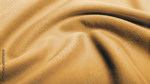 Golden, soft silk satin fabric with a smooth, shiny texture creates a luxurious and elegant golden textile background pattern