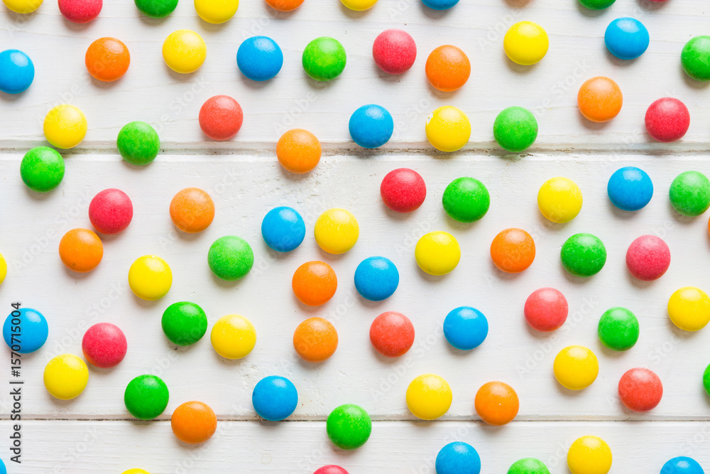 Obraz premium colorful candies as background top view. Seamless pattern with candy. Many sweet candies close-up
