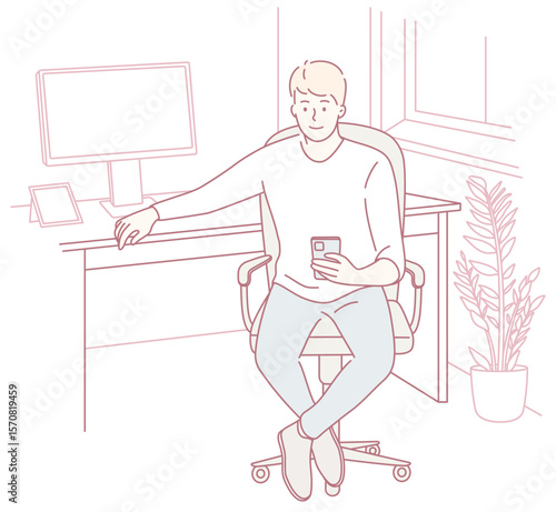 A young man sits comfortably in a modern office, engaged with his smartphone while relaxing in a chair