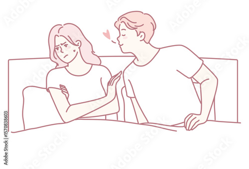 A playful couple is sharing a tender moment in bed, beautifully showcasing their intimacy and deep connection
