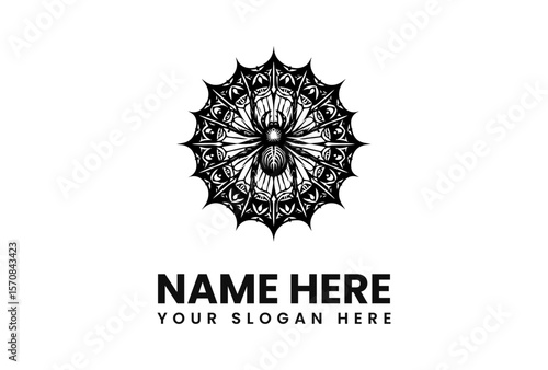 Intricate black and white spider design with elaborate web and text.