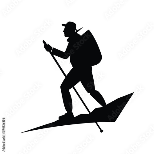 Black silhouette of hiker with backpack and poles on snowy slope