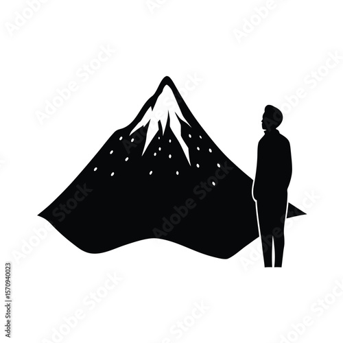 Black silhouette of person observing snow falling on mountain